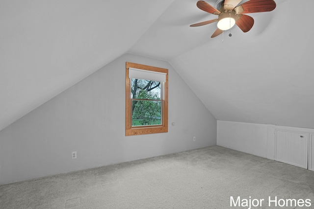 bonus room featuring carpet floors, a ceiling fan, and lofted ceiling