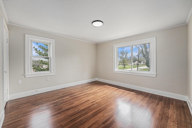 unfurnished room with wood-type flooring, ornamental molding, and baseboards