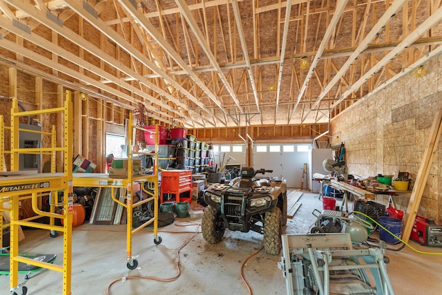 misc room featuring concrete floors and a garage