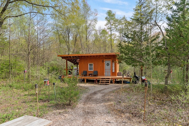 view of outdoor structure with a forest view