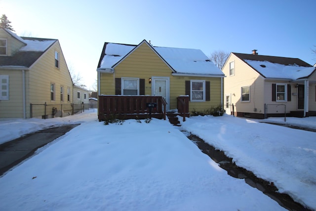 bungalow with fence and a wooden deck