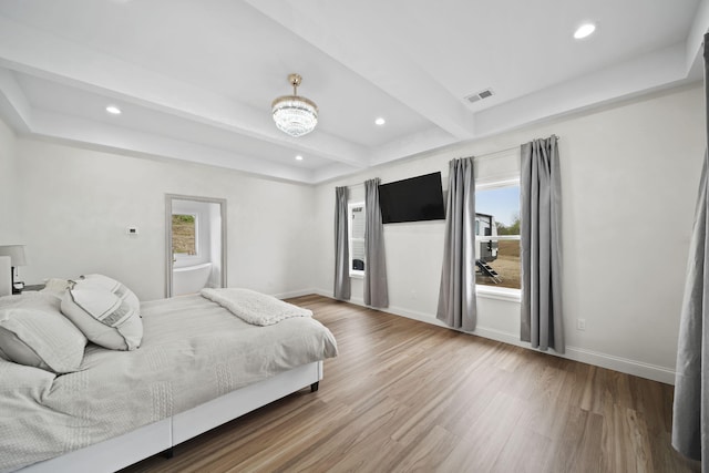 bedroom with visible vents, recessed lighting, wood finished floors, and multiple windows