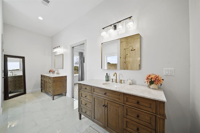 bathroom with visible vents, plenty of natural light, a sink, and marble finish floor