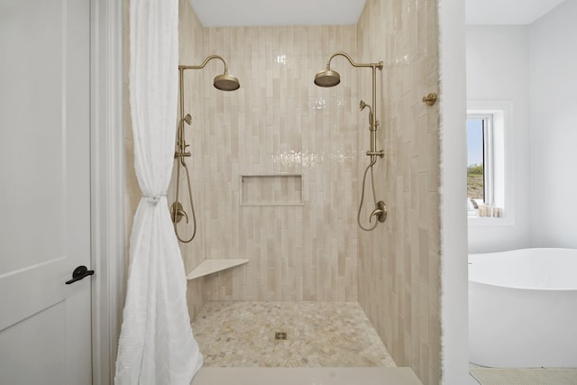 full bath with tiled shower and a soaking tub