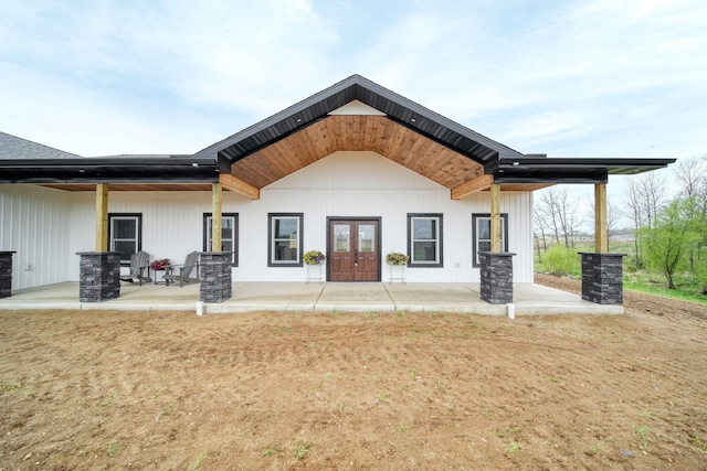 rear view of house featuring a patio area and french doors