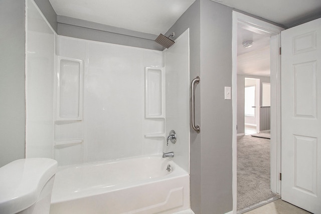full bathroom with baseboards, toilet, and bathing tub / shower combination