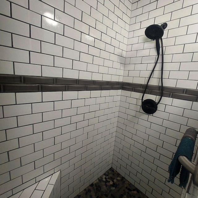 full bathroom with a tile shower