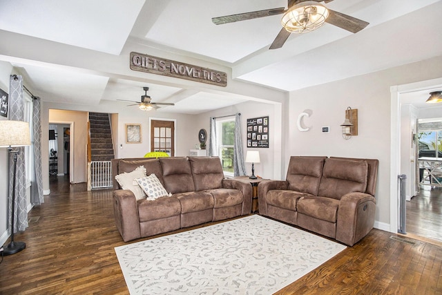 living area featuring baseboards, a ceiling fan, dark wood-style floors, and visible vents