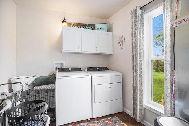 laundry area featuring cabinet space, separate washer and dryer, baseboards, and dark wood-style floors