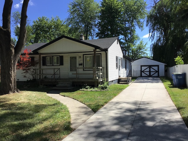 23822 Wellington Ave, Warren, MI 48089 - bungalow-style home with covered porch, an outbuilding, a front lawn, and crawl space