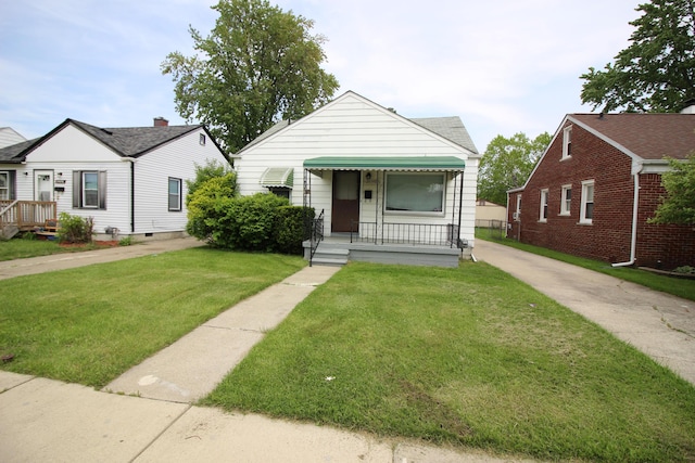 24648 Wilmot Ave, Eastpointe, MI 48021 - view of front facade with a front yard