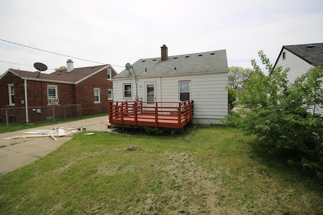 24648 Wilmot Ave, Eastpointe, MI 48021 - back of house with fence, a deck, cooling unit, a chimney, and a yard