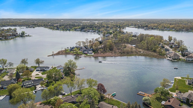aerial perspective of suburban area featuring a nearby body of water