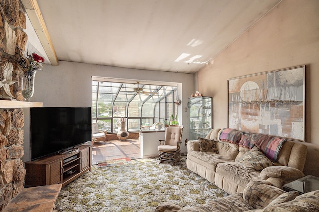 living room with a sunroom and high vaulted ceiling