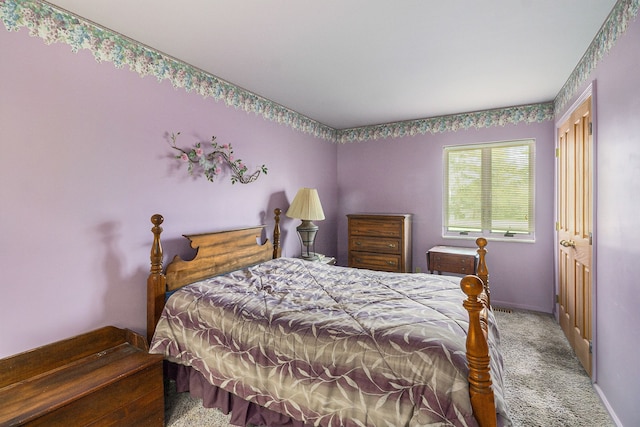 carpeted bedroom with baseboards