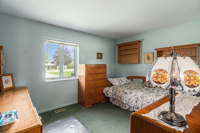 bedroom featuring carpet floors and baseboards