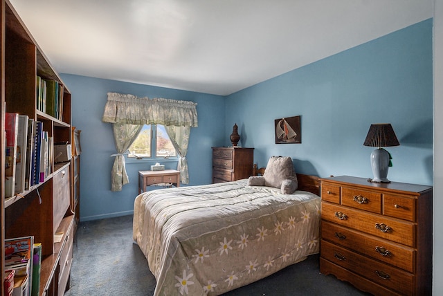 bedroom featuring carpet flooring and baseboards