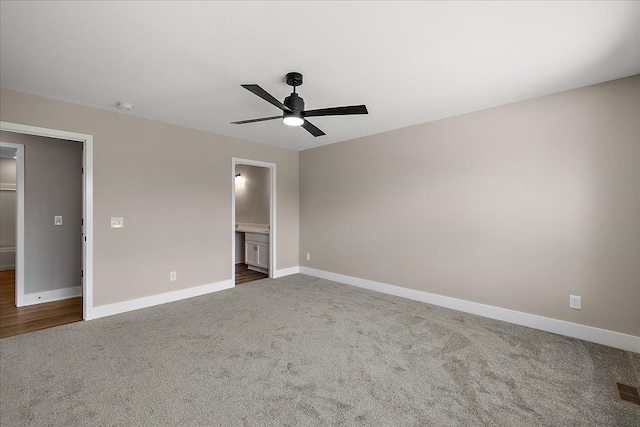 2600 Collegewood St, Ypsilanti, MI 48197 - unfurnished bedroom with dark colored carpet, baseboards, and ensuite bathroom