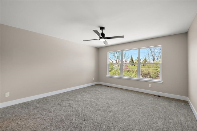 2600 Collegewood St, Ypsilanti, MI 48197 - spare room featuring baseboards, carpet flooring, and ceiling fan