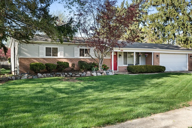 5874 Thornaby Dr, Waterford, MI 48329 - view of front of house with driveway, an attached garage, brick siding, and a front yard