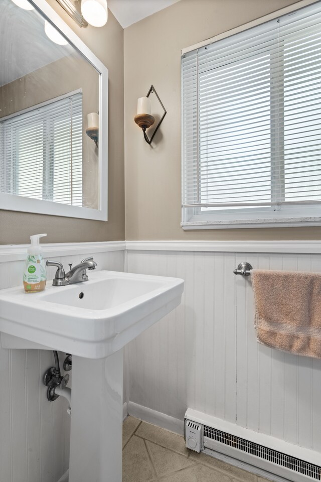 5874 Thornaby Dr, Waterford, MI 48329 - bathroom with tile patterned flooring, wainscoting, and a baseboard heating unit