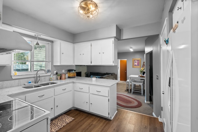 5874 Thornaby Dr, Waterford, MI 48329 - kitchen featuring a sink, light countertops, white cabinets, dark wood-style floors, and electric range