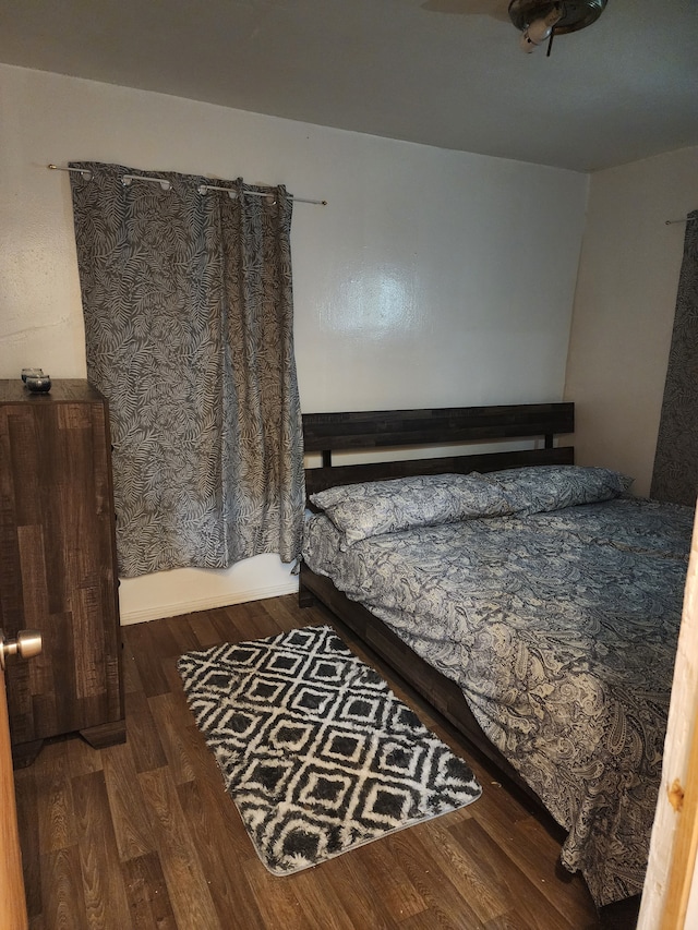 bedroom featuring wood finished floors
