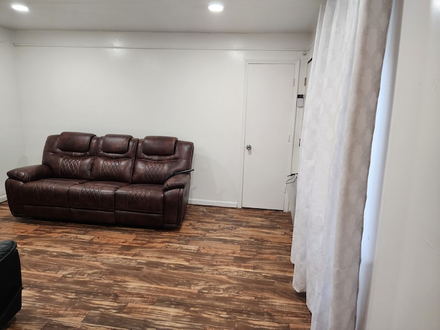 living room with recessed lighting and wood finished floors