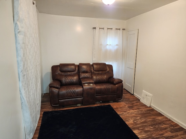 living room with visible vents and wood finished floors
