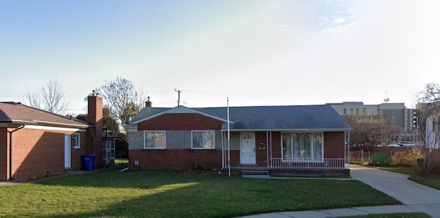 11916 Geoffry Dr, Warren, MI 48093 - view of front of home featuring brick siding, a front lawn, and covered porch