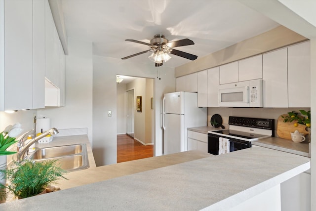 kitchen with ceiling fan, a sink, light countertops, white cabinets, and white appliances