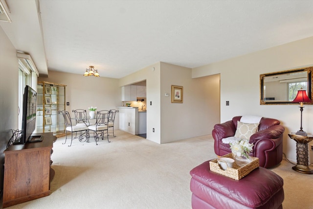 living room with a healthy amount of sunlight and carpet flooring