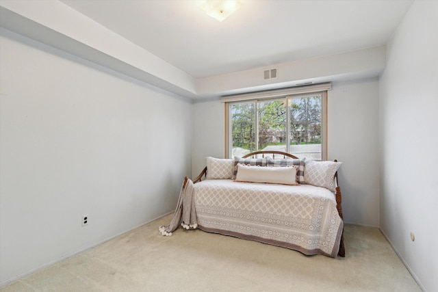 bedroom featuring carpet flooring and visible vents