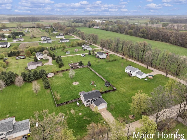 birds eye view of property featuring a rural view