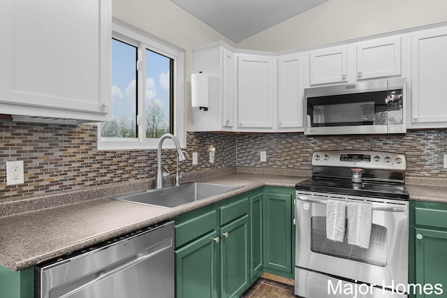 kitchen with a sink, white cabinetry, green cabinets, and stainless steel appliances