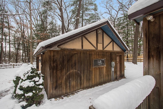 921 Fourth St, Pullman, MI 49450 - snow covered structure with fence and an outbuilding