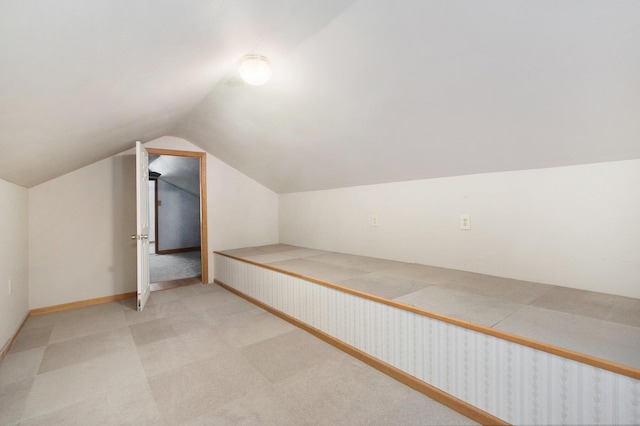 921 Fourth St, Pullman, MI 49450 - additional living space with light colored carpet, baseboards, and lofted ceiling