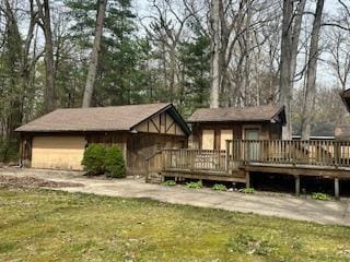 921 Fourth St, Pullman, MI 49450 - rear view of house with a lawn and a deck