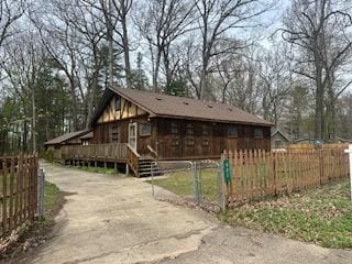 921 Fourth St, Pullman, MI 49450 - view of home's exterior with a wooden deck and fence private yard