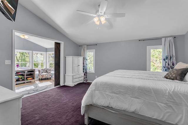 bedroom with dark colored carpet, a ceiling fan, lofted ceiling, and multiple windows