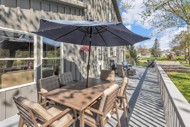 wooden deck with outdoor dining space