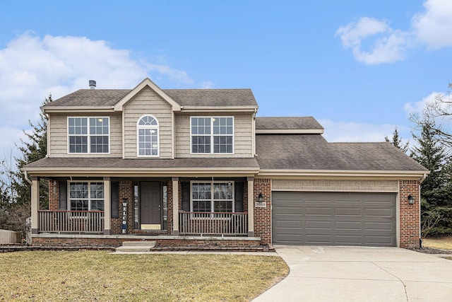view of front of house with an attached garage, a front lawn, covered porch, and concrete driveway