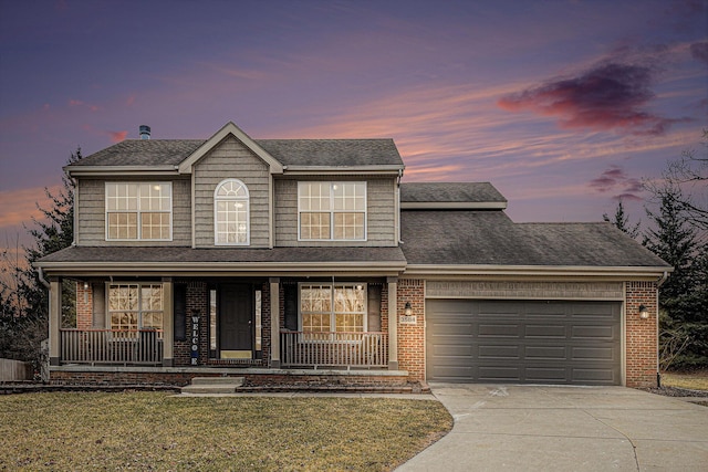 view of front facade with a porch, brick siding, concrete driveway, and a garage