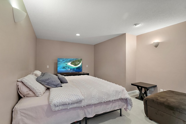 carpeted bedroom with recessed lighting
