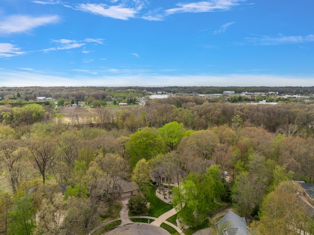 aerial view featuring a view of trees