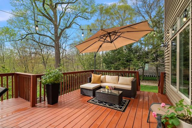 wooden deck featuring fence and outdoor lounge area