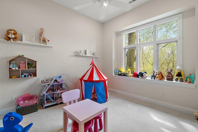 recreation room with baseboards, a ceiling fan, carpet flooring, and visible vents