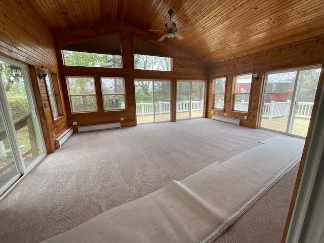 unfurnished sunroom featuring a baseboard radiator, a baseboard heating unit, a healthy amount of sunlight, and high vaulted ceiling