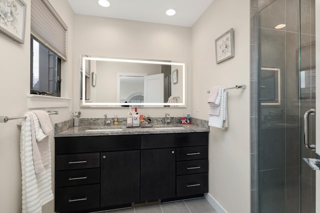 1049 Hampton Cir Unit 44, Detroit, MI 48207 - full bath featuring a sink, double vanity, a stall shower, and baseboards