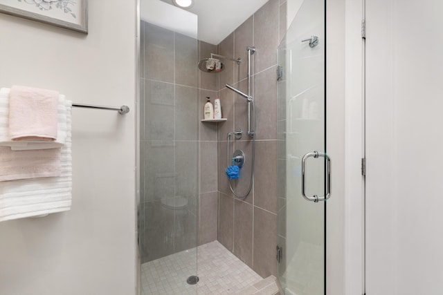 1049 Hampton Cir Unit 44, Detroit, MI 48207 - bathroom featuring a shower stall